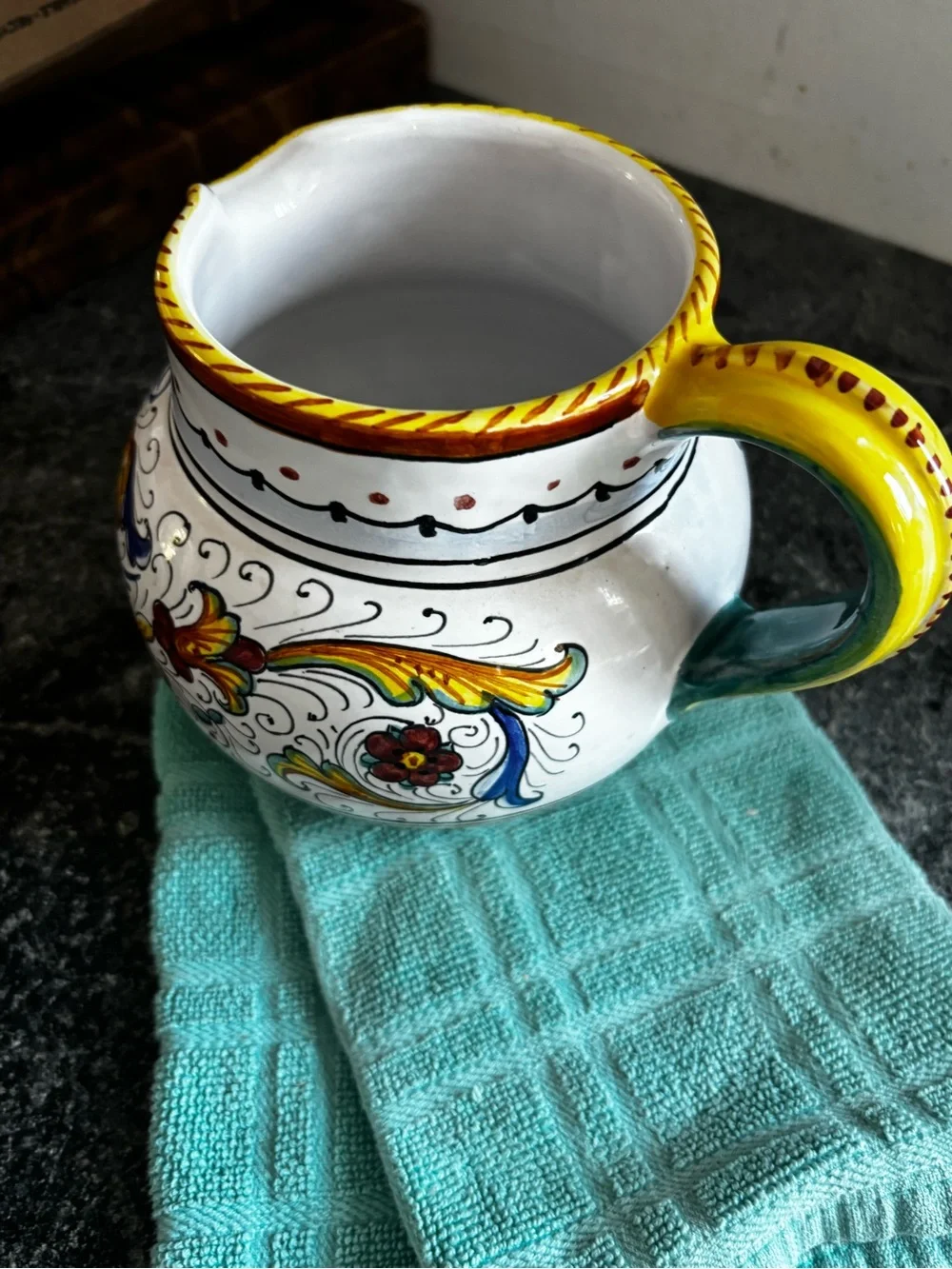 Hand-Painted White Ceramic Pitcher with Yellow, Blue and Green Motif